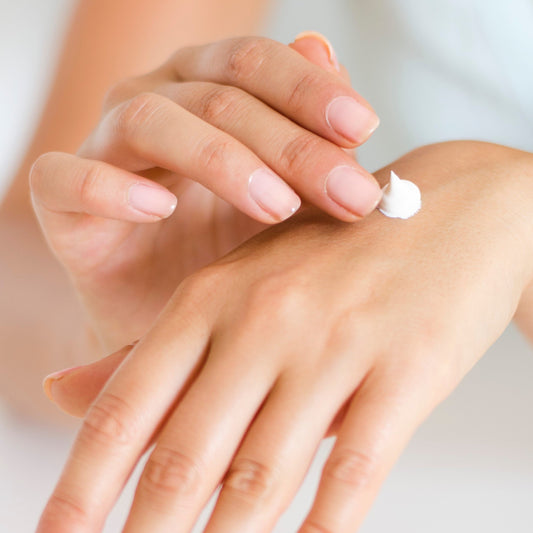 someone applying hand cream for dry chapped skin