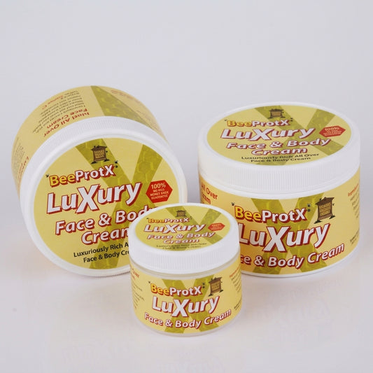 Three jars of BeeProtX Luxury Face & Body Cream in different sizes, arranged on a clean white background.