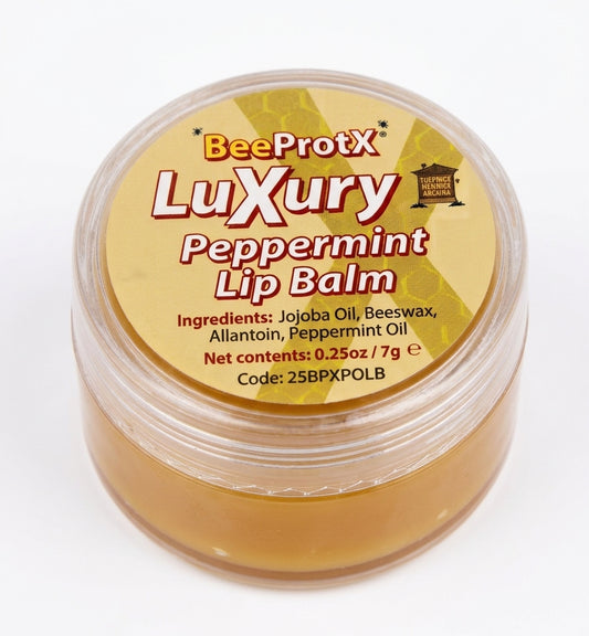 A round clear plastic jar of BeeProtX Luxury Peppermint Lip Balm, showing the golden-brown balm inside, with a yellow label on a white background.