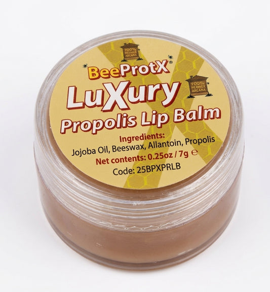 A clear plastic jar of BeeProtX Luxury Propolis Lip Balm with a yellow honeycomb-patterned label, containing a brown balm, on a white background.