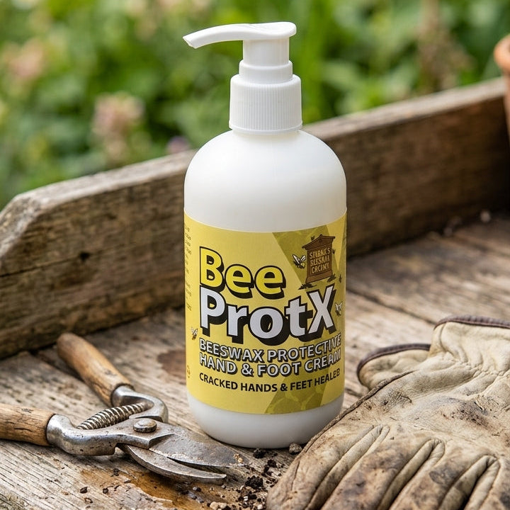 A pumper of BeeProtX Beeswax Hand & Foot cream sits on a rustic wooden workbench surrounded by gardening tools, including pruning shears, gloves, and soil, with a blurred garden background.
